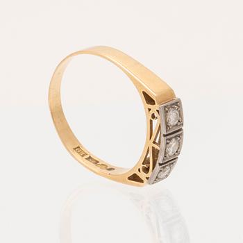 An 18K white and red gold ring set with round brilliant-cut diamonds.