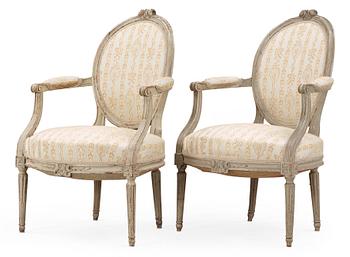 A pair of Louis XVI late 18th century armchairs.