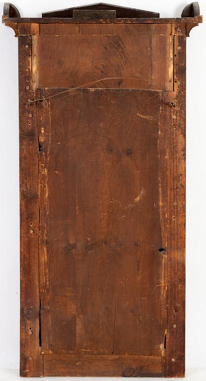 A mahogany veneered mirror with console table, first half of the 19th Century.