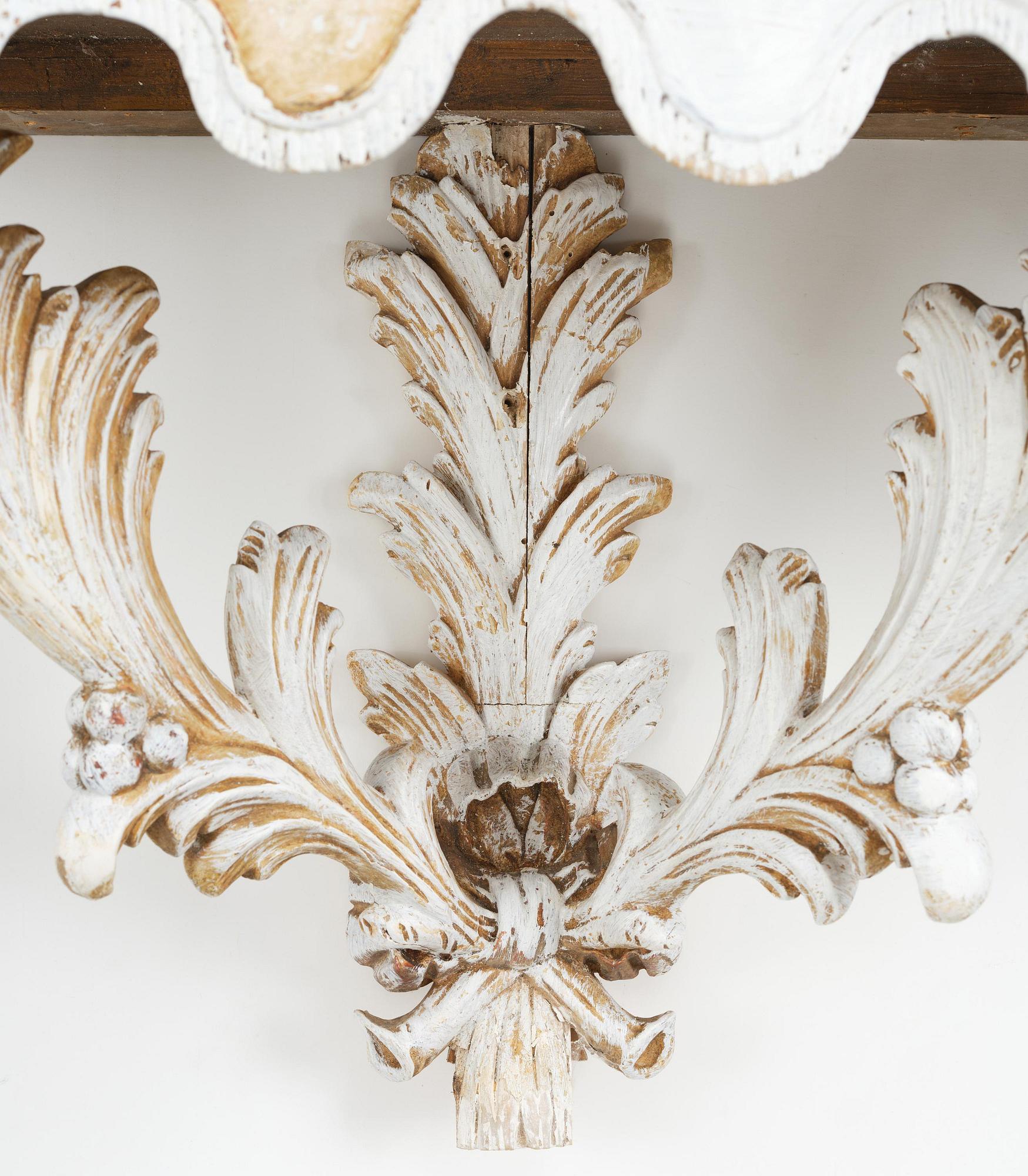 A pair of French Louis XVI-style consoles, late 19th century.