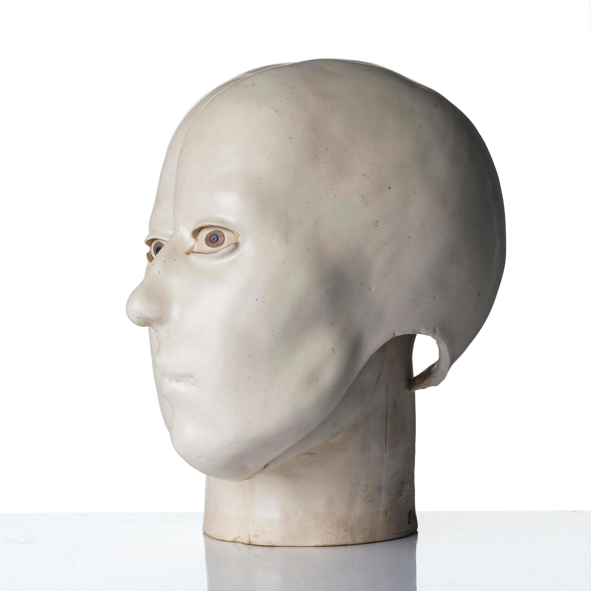 Britt-Ingrid "BIP" Persson, a glazed stoneware sculpture of faces, ca. 1970.