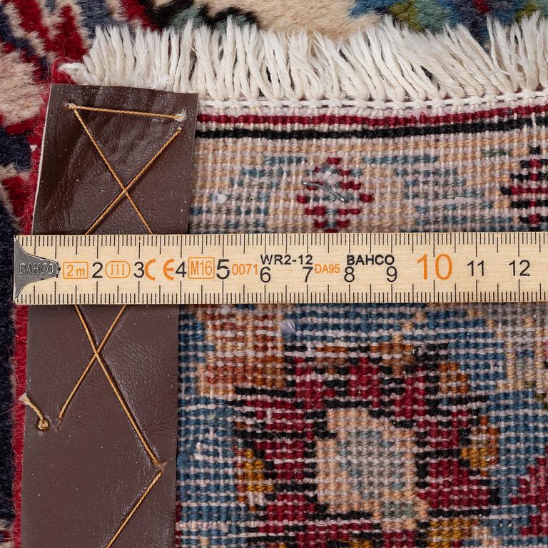 An oriental carpet, a. 419 x 295 cm.