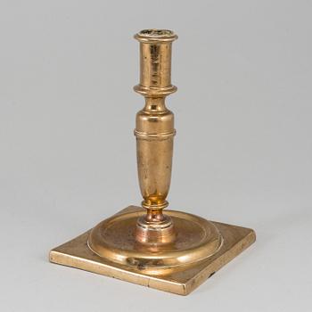 A 17th century bronze candlestick.