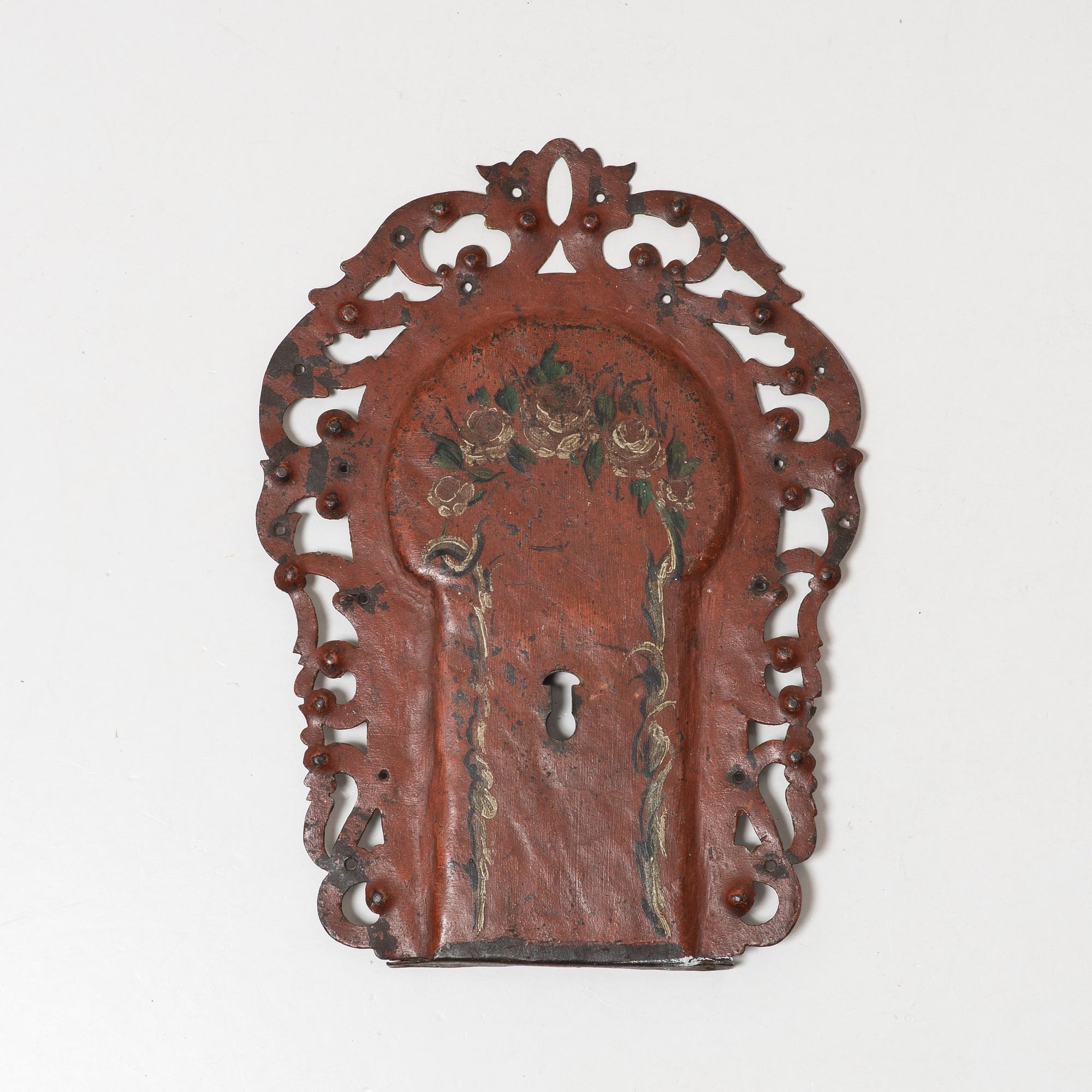 A Swedish baroque polychrome painted wrought-iron key mount, early 18th century.