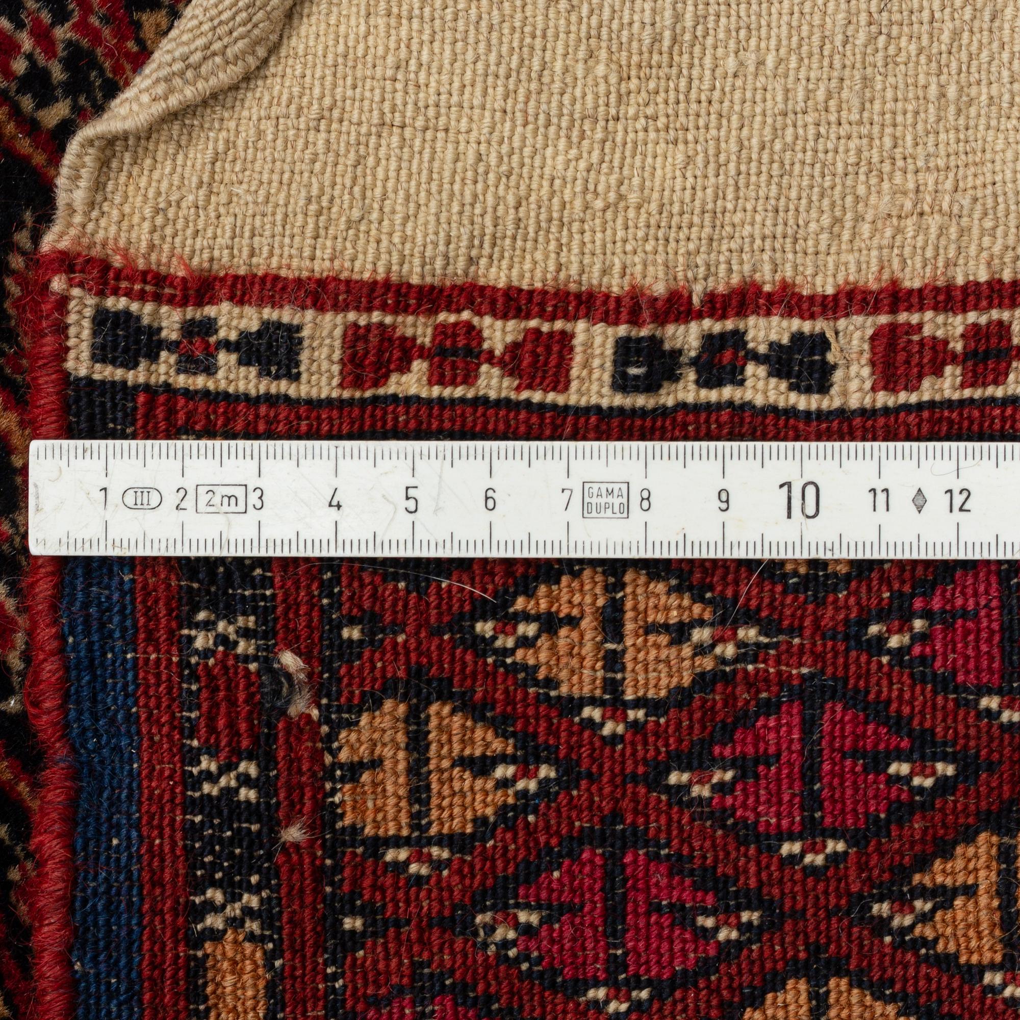 A Turkish Antique Carpet, circa 397 x 330 cm.