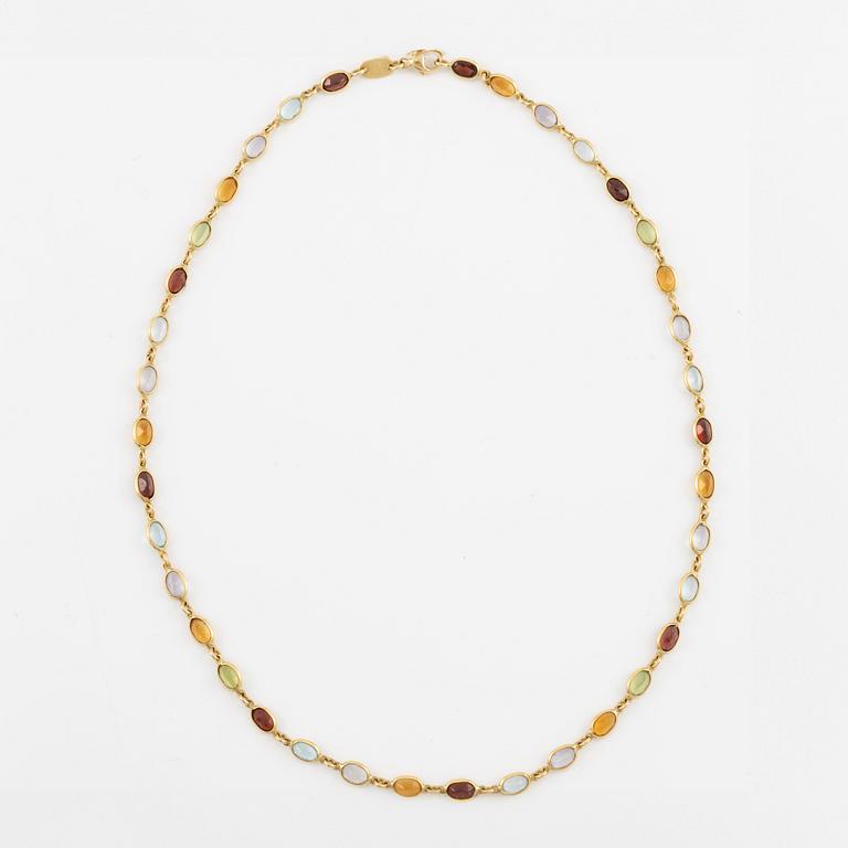 Necklace in 18K gold set with, among other stones, peridot, topaz, citrine, and amethyst.