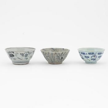 A Chinese blue and white box with cover, Ming dynasty, 17th century and three bowls, Southeast Asia, 19th/20th century.