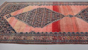 A CARPET, an antique Bidjar kelly, ca 587 x 230 cm.