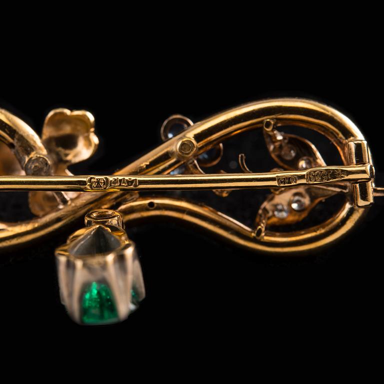 A BROOCH, 56 gold, drop cut emerald, diamonds, sapphires. Marked AT. St. Petersburg 1880 s. Weight 4,7 g.
