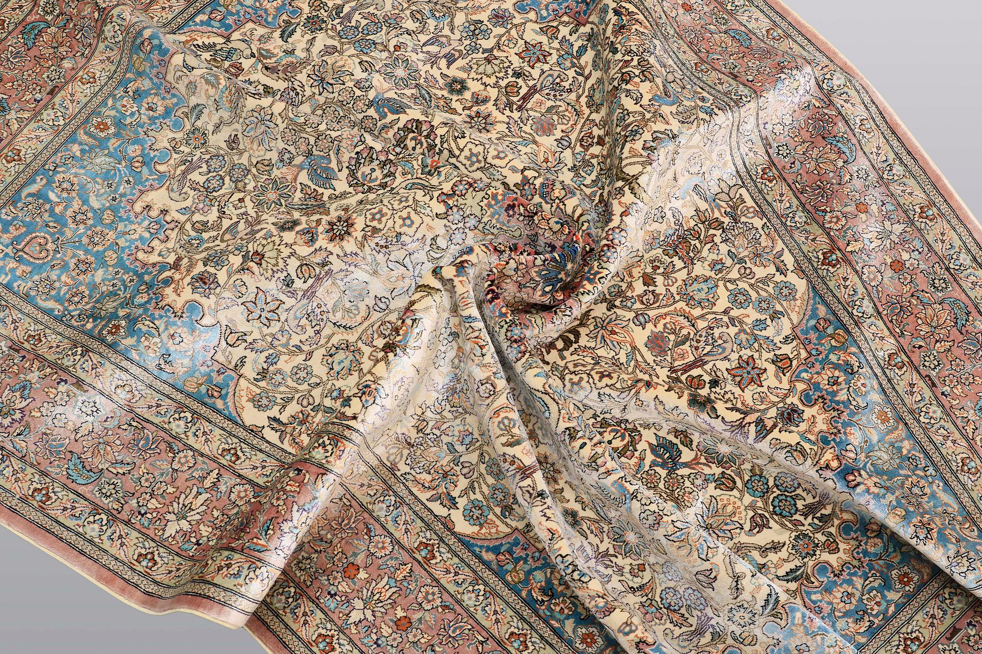 A rug, Figural Oriental silk,  signed, ca 175 x 125 cm.