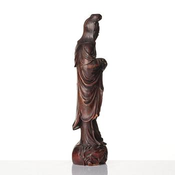 A wooden sculpture of Guanyin with metal inlay, Qing dynasty.