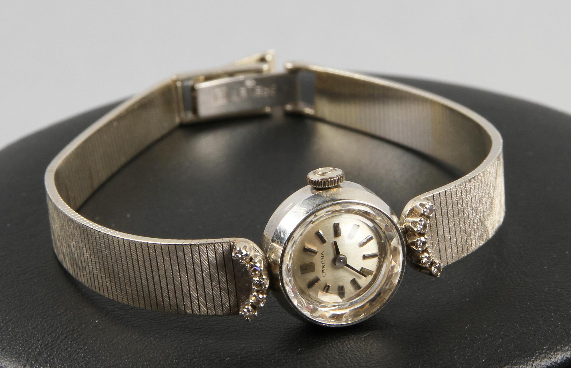 DAMARMBANDSUR, 18 K vitguld samt 10 diamanter, art deco, Certina, Schweiz.