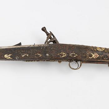 A snaphaunce gun, 19th Century.