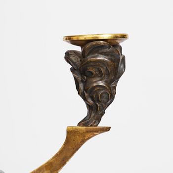 A patinated and ormolu six-light Empire chandelier, Stockholm, first part 19th century.