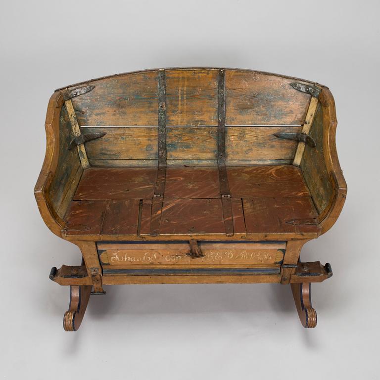 A 19th-century wooden sleigh.