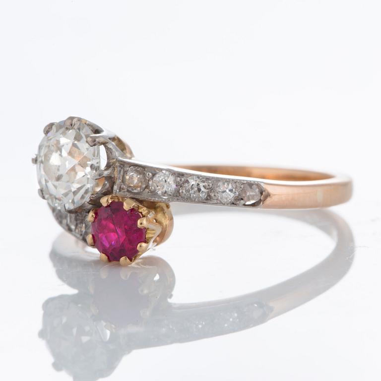 A ring set with an old-cut diamond ca 0.75 ct quality ca K-L vs and a faceted ruby.