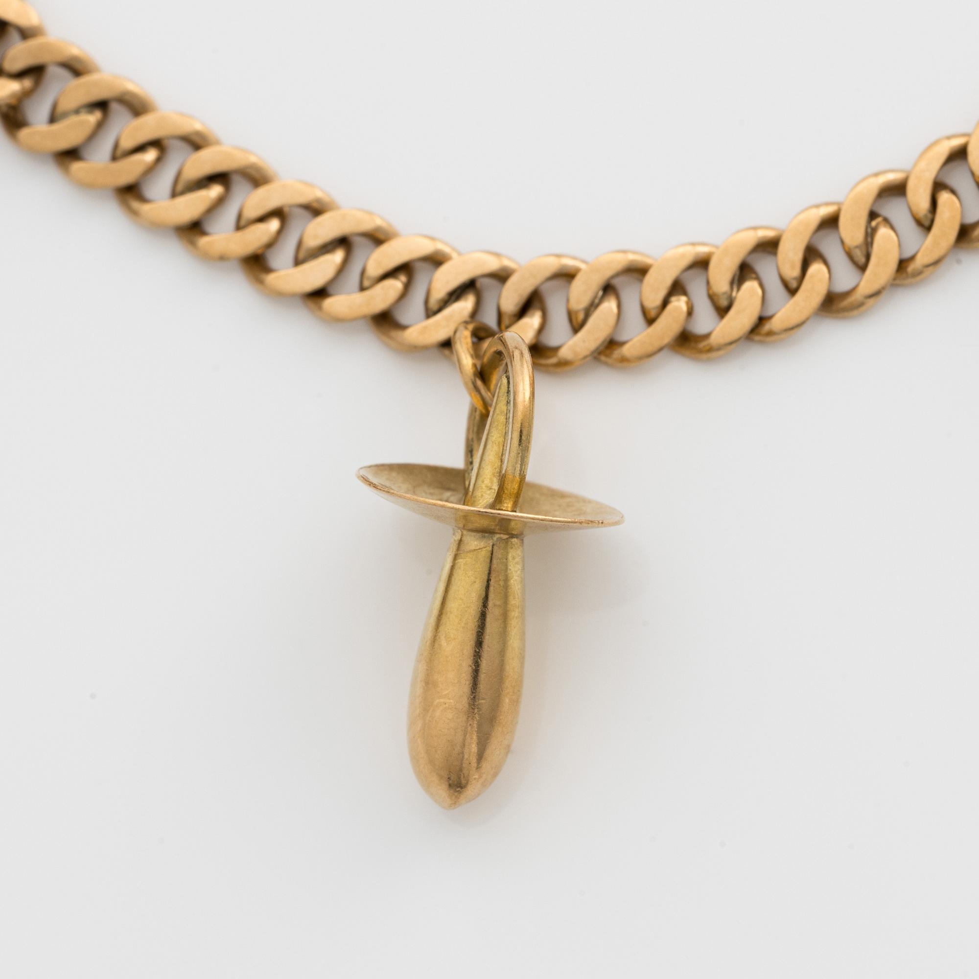 Armband 18k guld med berlocker.