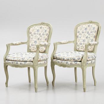 A pair of rococo-style open armchairs, 20th century.