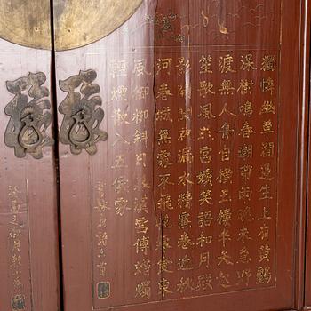 A red lacquered cabinet, China, early 20th century.