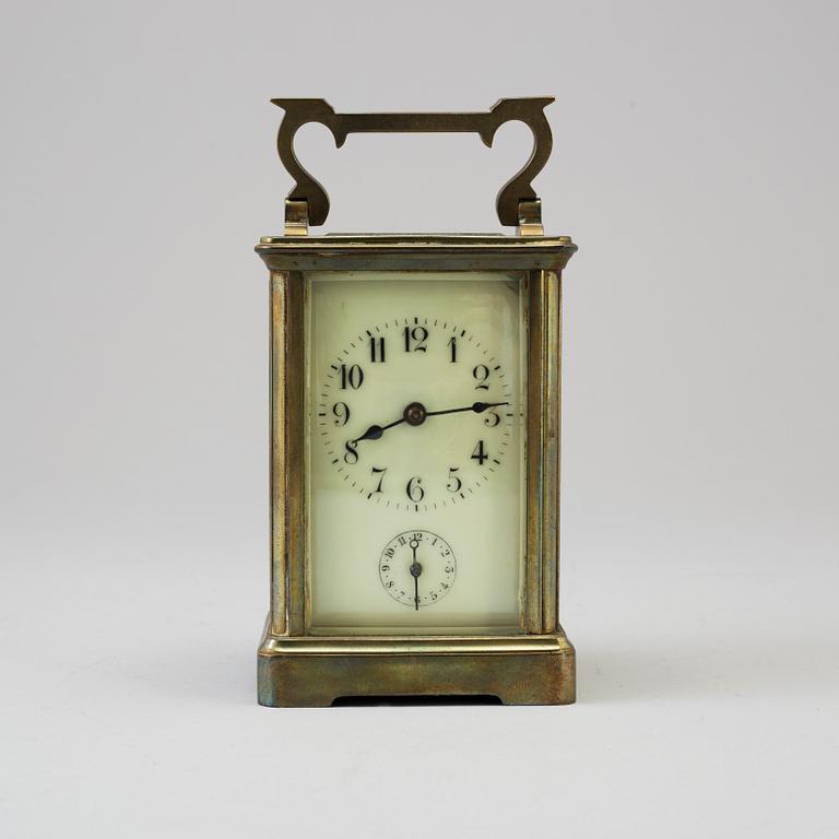 An early 20th century brass and glass carriage clock.