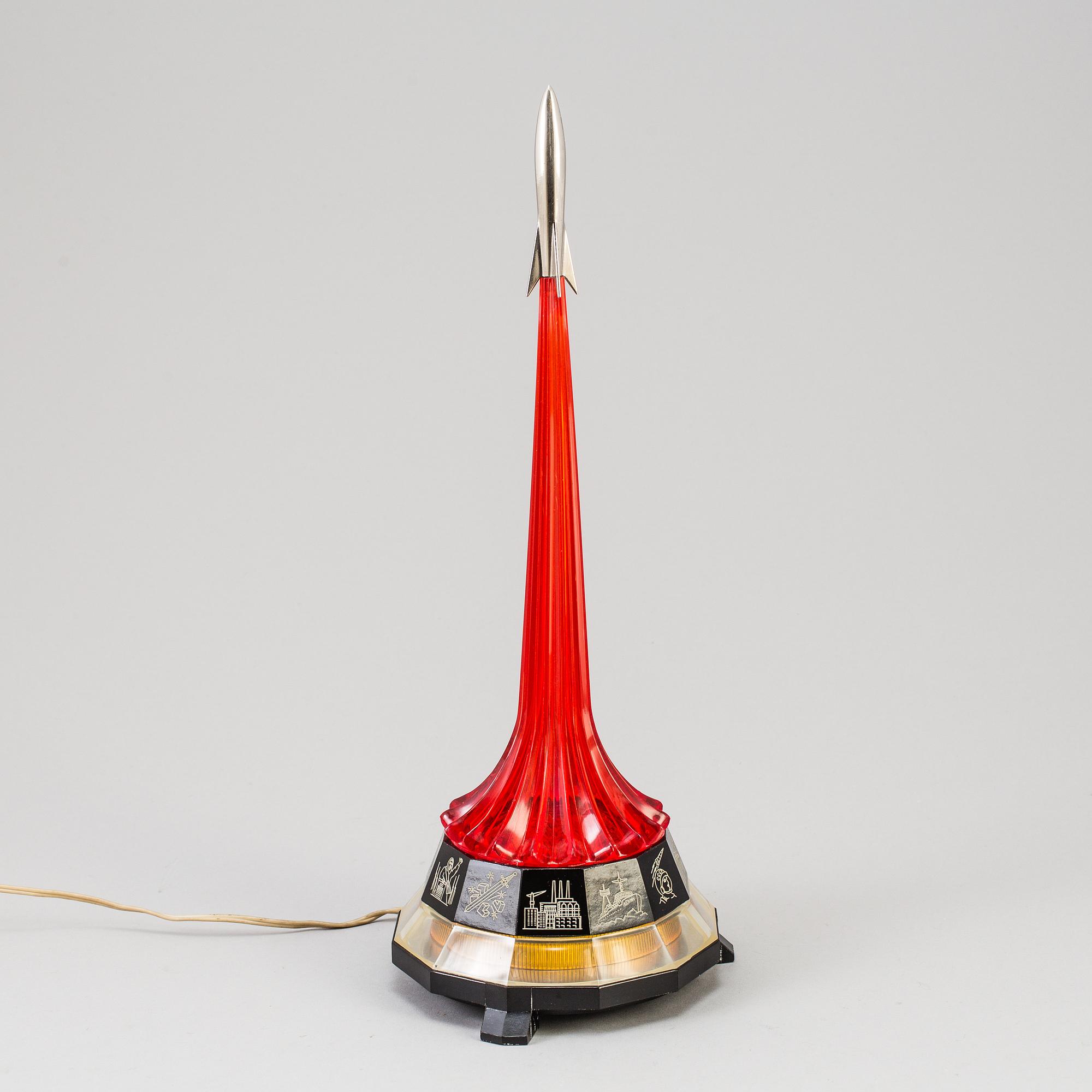 Soviet perspex table lamp with a rocket Finial, depicting Yri Gagarin's trip in space, the base showing Soviet symbols.