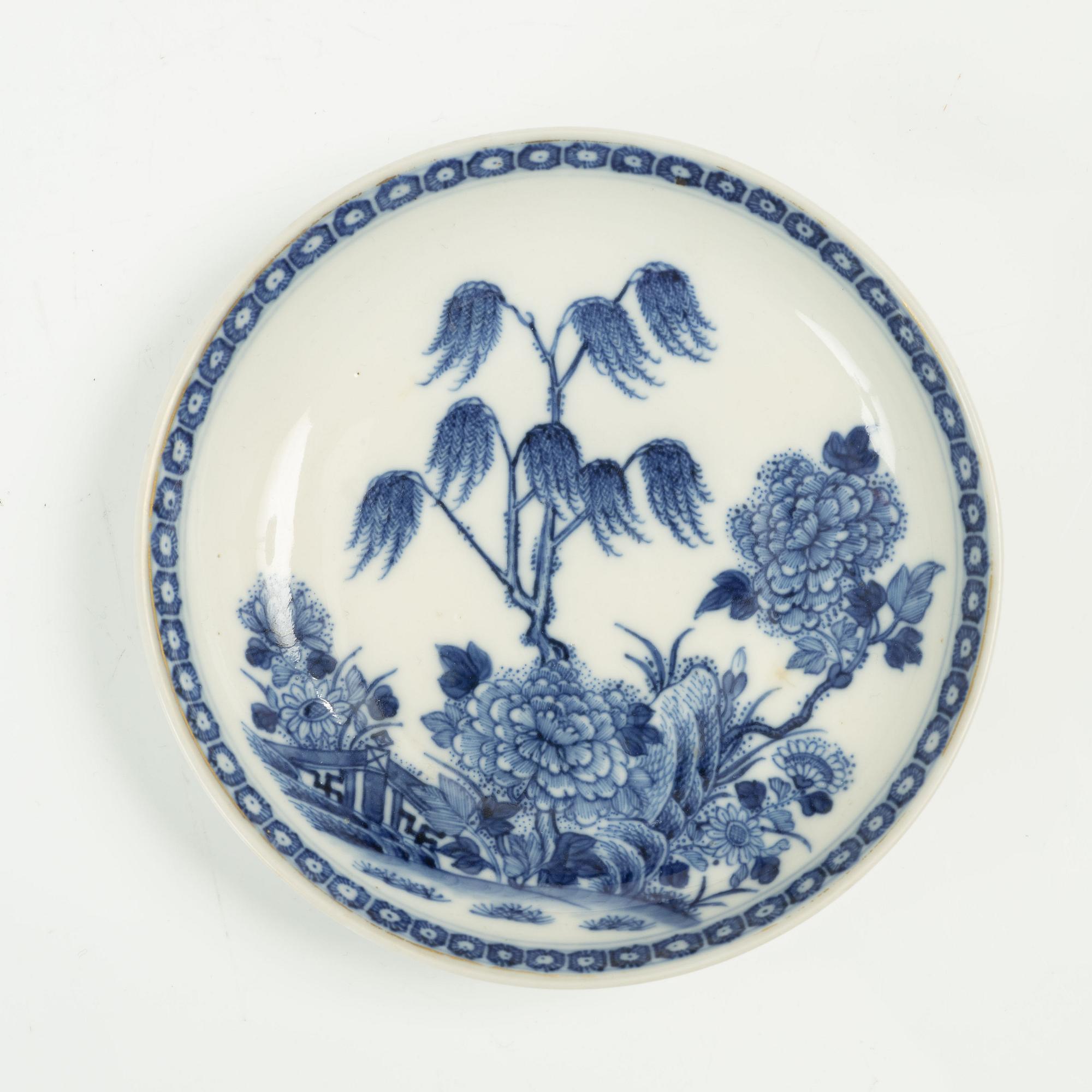 A Chinese soft paste cup with saucer, Qing dynasty, 18th century.