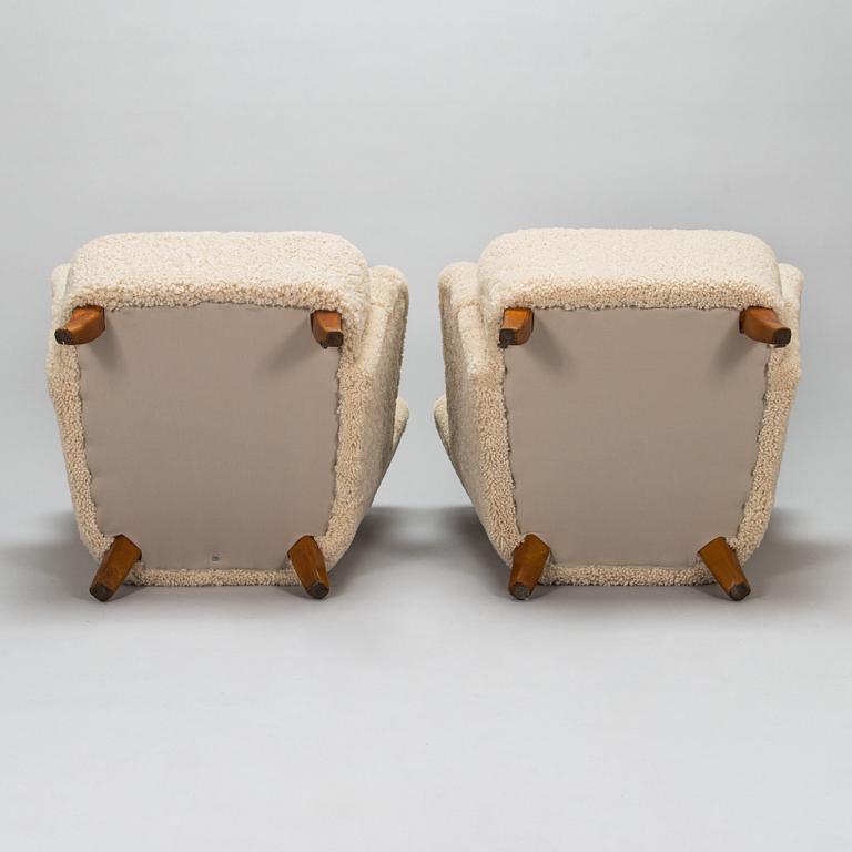 A pair of mid-20th-century armchairs.