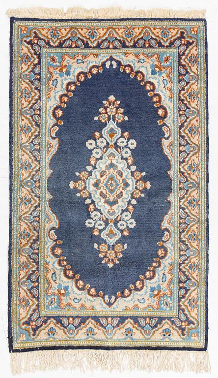 An old Kerman rug, ca. 130 x 91 cm.