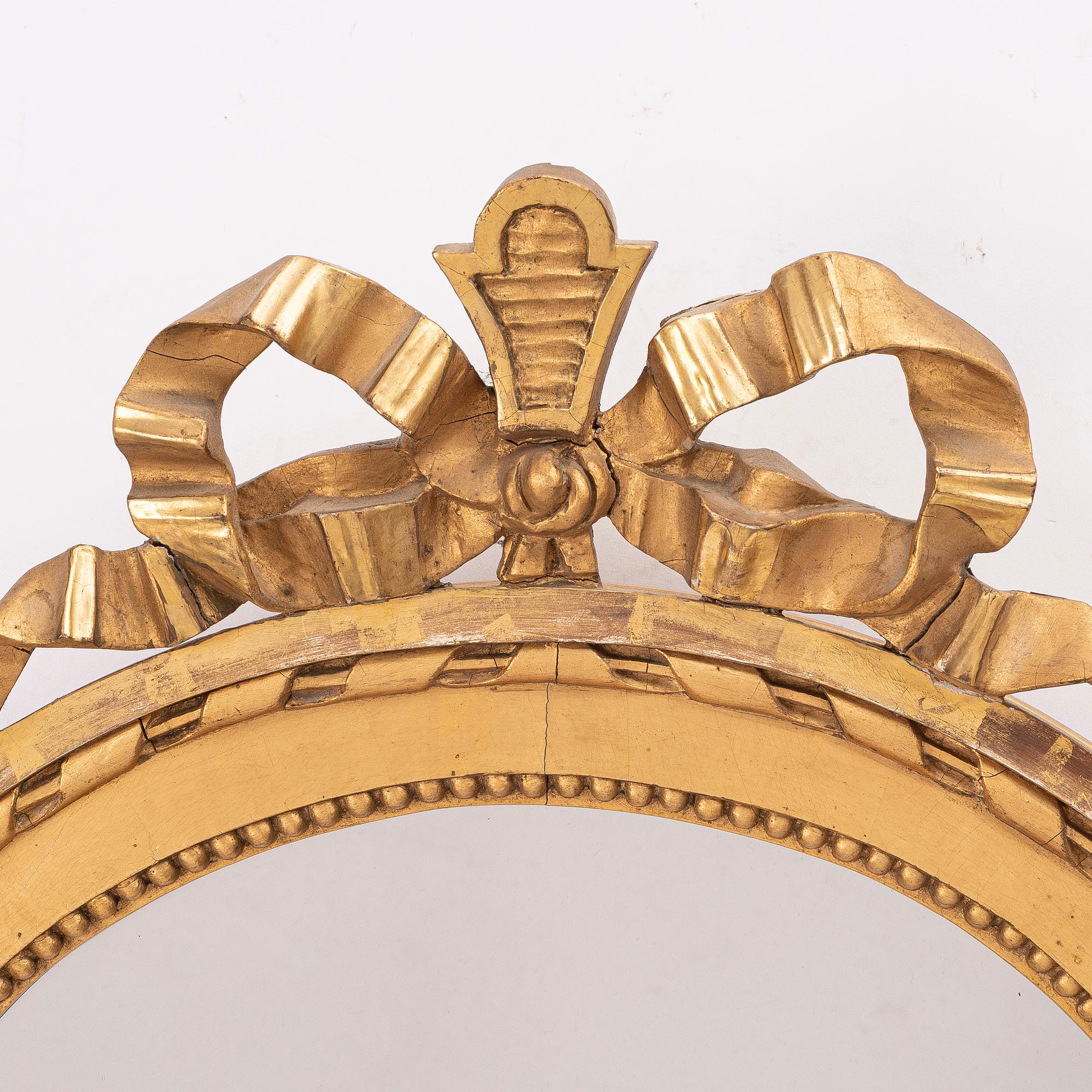 A Gustavian style mirror, early 20th century.