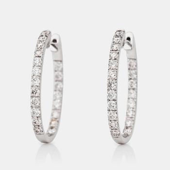 1229. A pair of ovale diamond, 1.38 cts according to engraving, loop earrings.