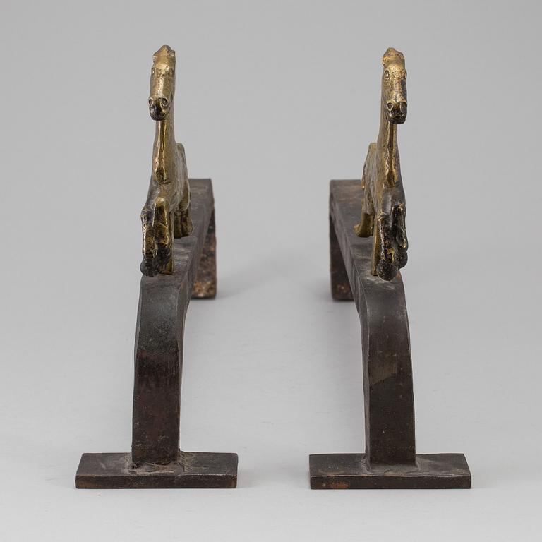 A PAIR OF IRON AND BRASS ANDIRONS by Tore Kullander, Borås 1943.