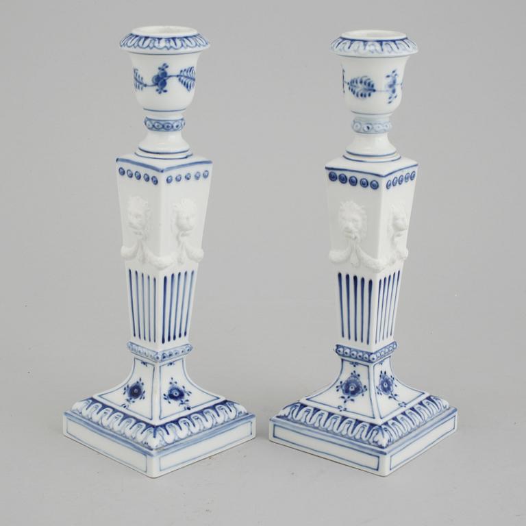 A pair of "Musselmalet" candel holders made by Royal Copenhagen, 20th century.