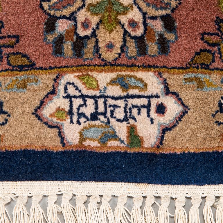 A signed rug, oriental, ca. 242 x 168 cm.