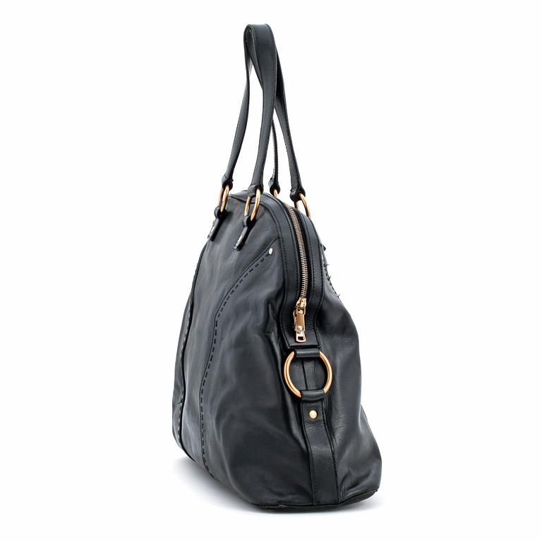 YVES SAINT LAURENT, a black leather shoulder bag, "Muse".