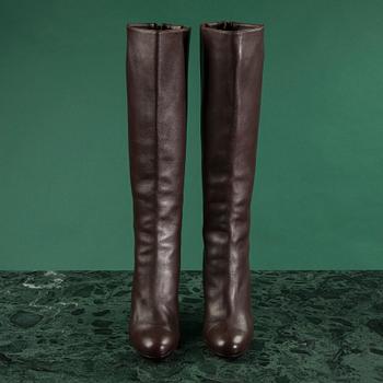 A pair of brown leather boots by Christian Louboutin, size 41 1/2.