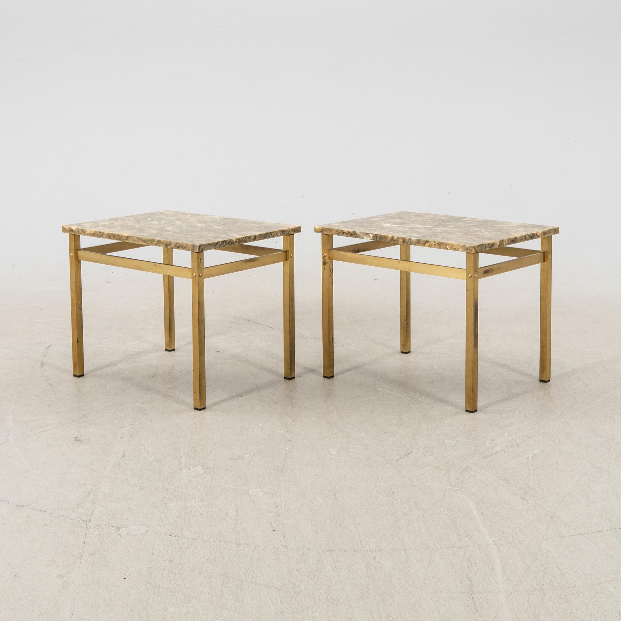 A pair of metal and stone side tables from the second half of the 20th century.