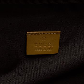 GUCCI, a monogram canvas dog bag.