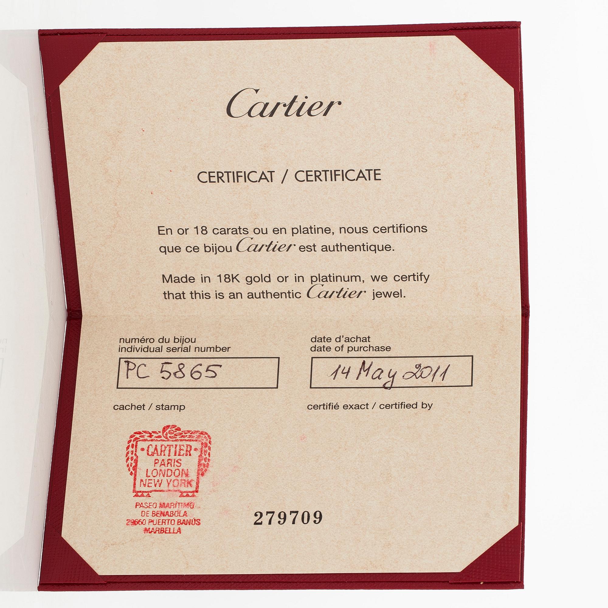 Cartier, an 18K gold 'Love' ring with three brilliant-cut diamonds.