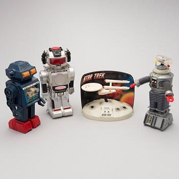 Three Vintage Toy Robots and a Table Clock.