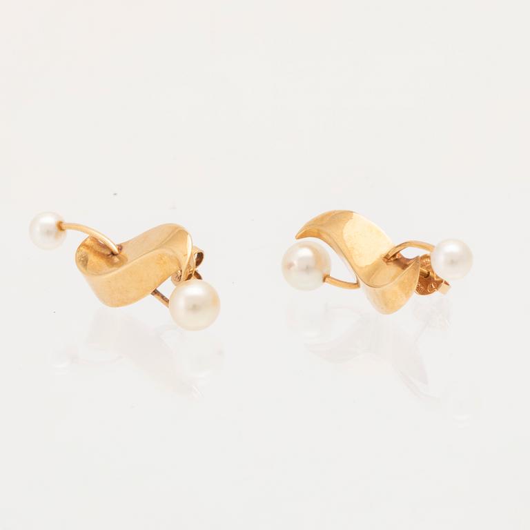 A pair of 18K gold earrings set with cultured pearls by Elon Arenhill.