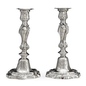 668. A pair of Rococo 18th century argent haché candlesticks.