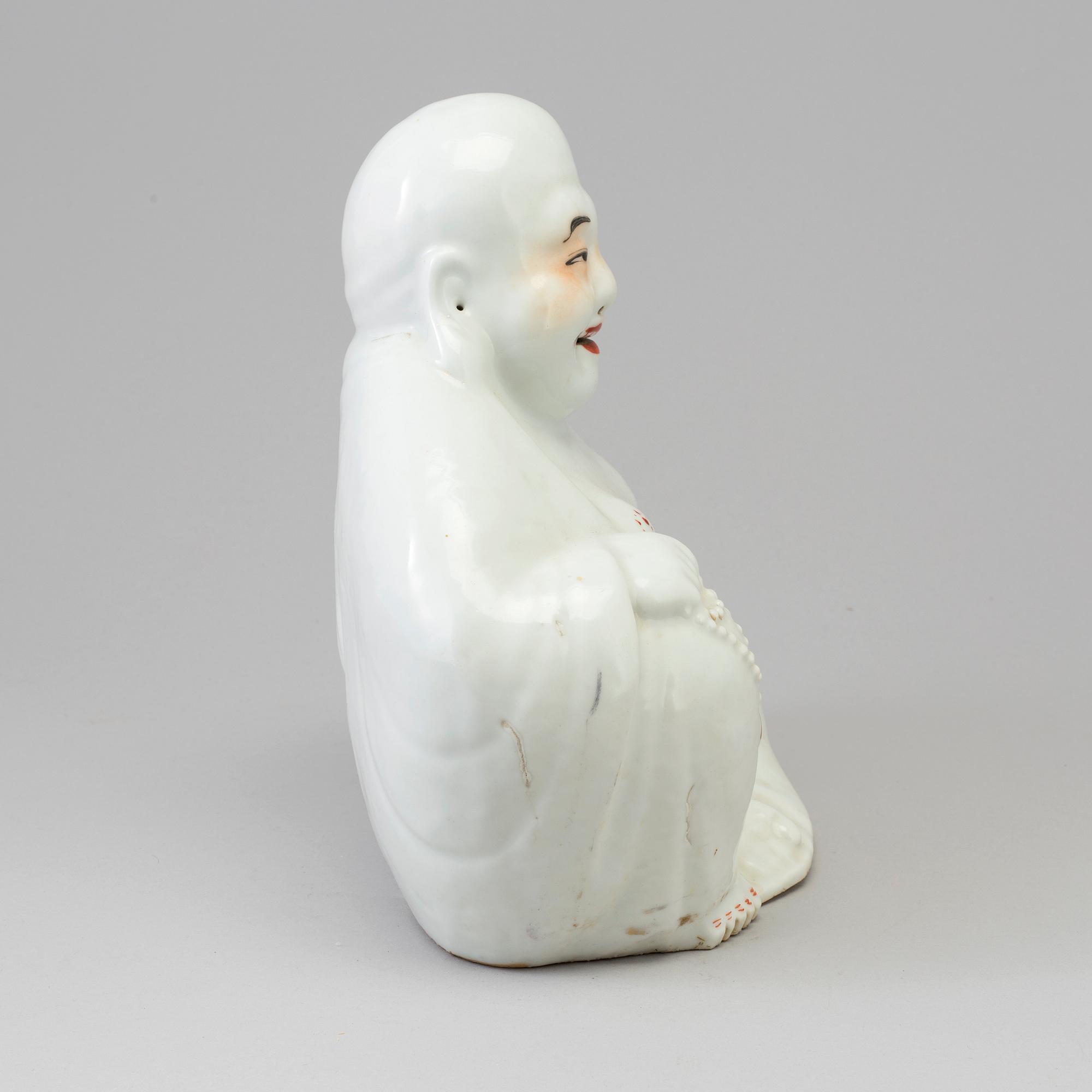 A Chinese porcelain Buddhai, 20th century.