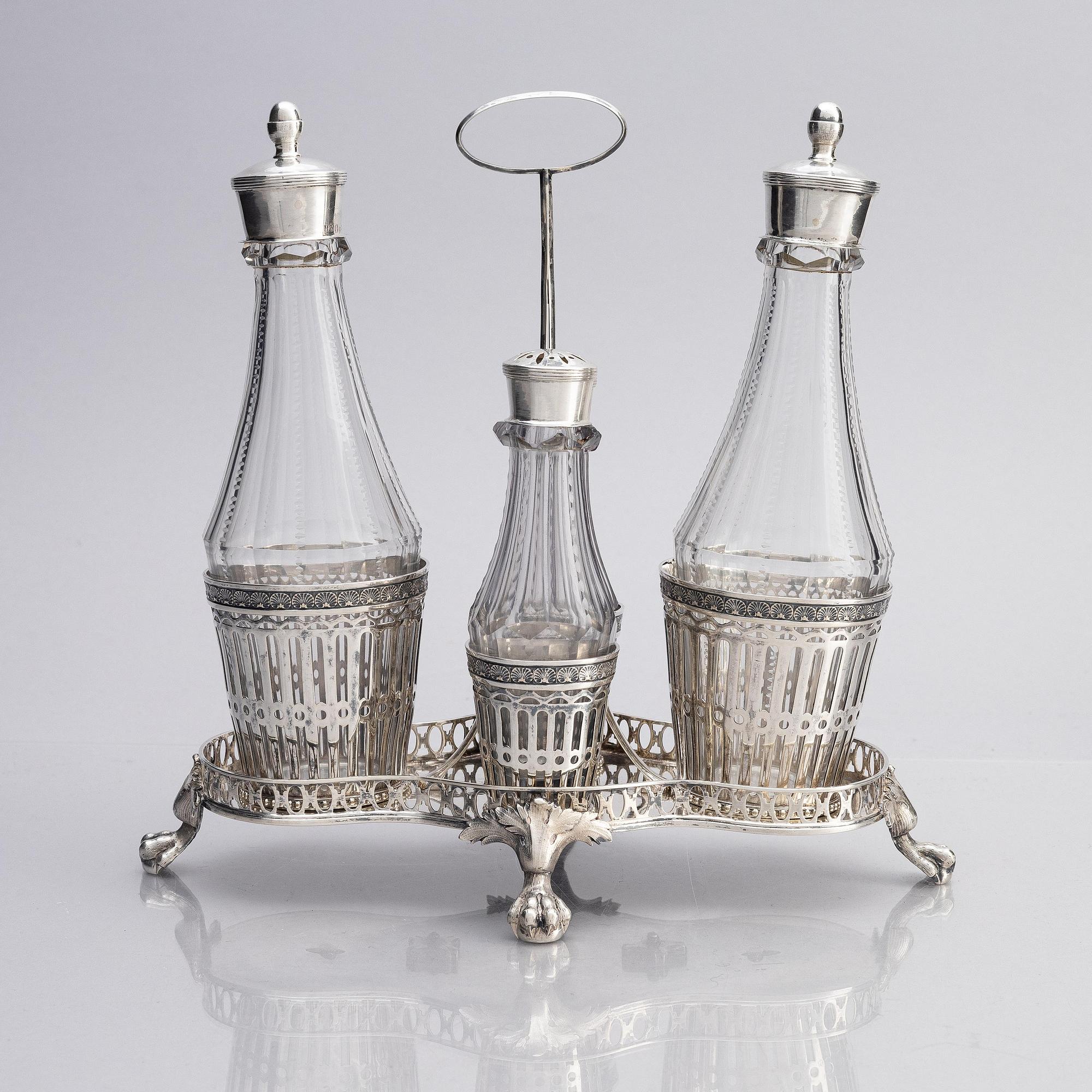 A Swedish 18/19th century silver and glass cruet-set, mark of Pehr Zethelius and Paul Wihlborg, Stockholm 1795 and 1814.