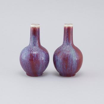 A pair of sang de boeuf vases, 20th cenutry.