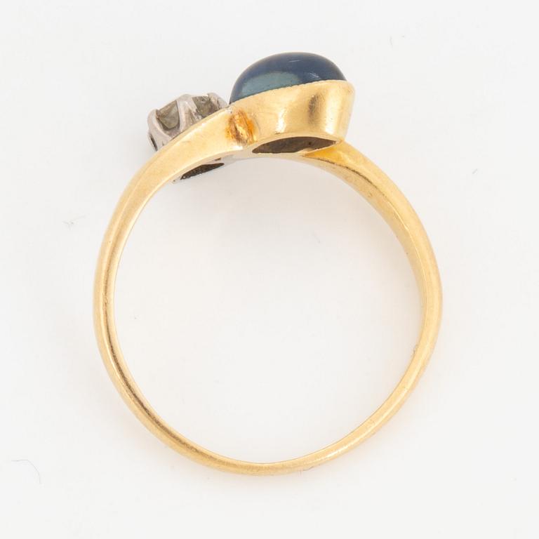 Cabochon-cut sapphire and old-cut diamond ring.