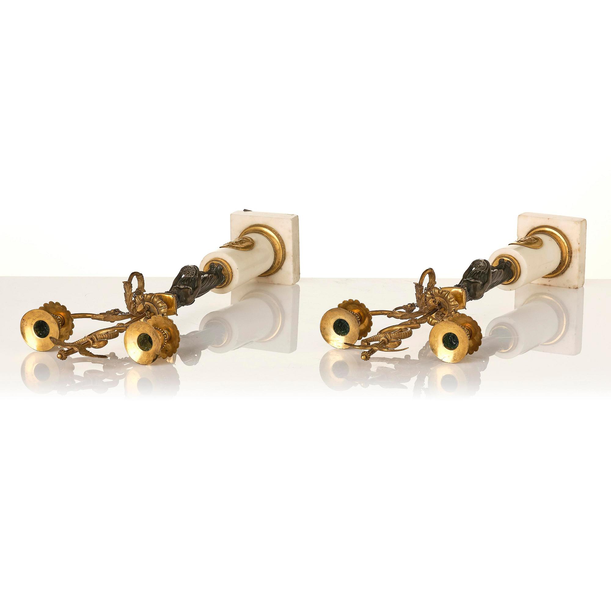 A pair of late Gustavian white marble and bronze candelabra.