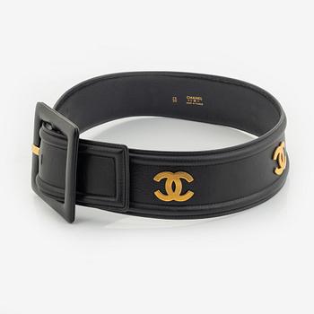 Chanel, a black leather and gold tone metal belt.