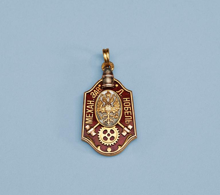 A Russian three colored gold and enamel commemorative plaque, makers mark of Alfred Thielemann for Fabergé, St. Petersburg 1902.