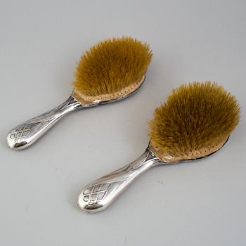 A PAIR OF ART NOUVEAU SILVER HAIR BRUSHES, Birmingham 1905.