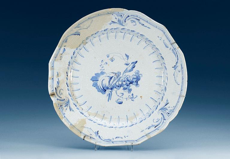 A Swedish Rörstrand faience charger, 18th Century.